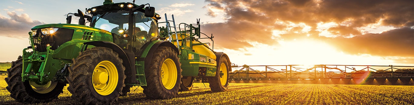 John Deere Tractor pulling a field sprayer