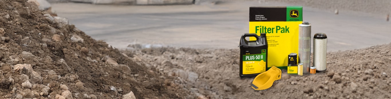 Filters and oil container sitting on gravel
