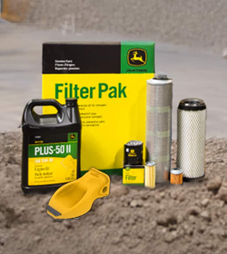 Filters and oil container sitting on gravel