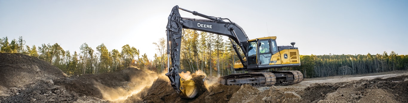 A new 230 P-Tier Excavator scoops a load of dirt on a construction jobsite