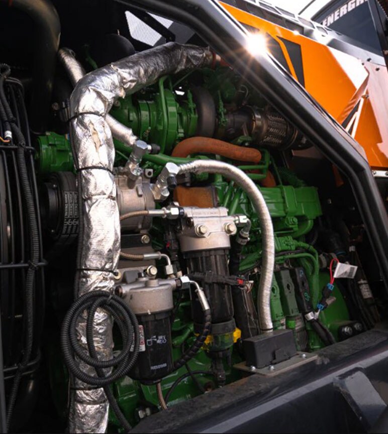 Green and black pipes with an orange machine.