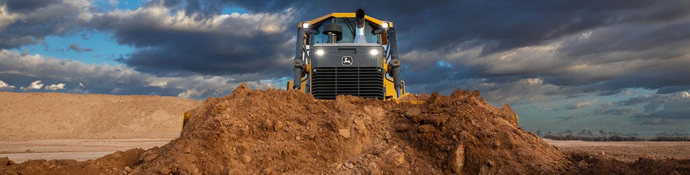 John Deere construction equipment moving dirt