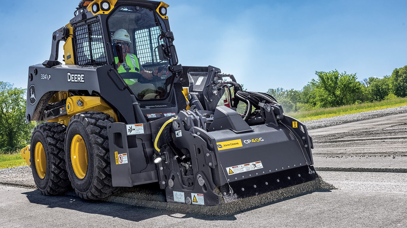 334 P-Tier skid steer with CP40G cold planer attachment.