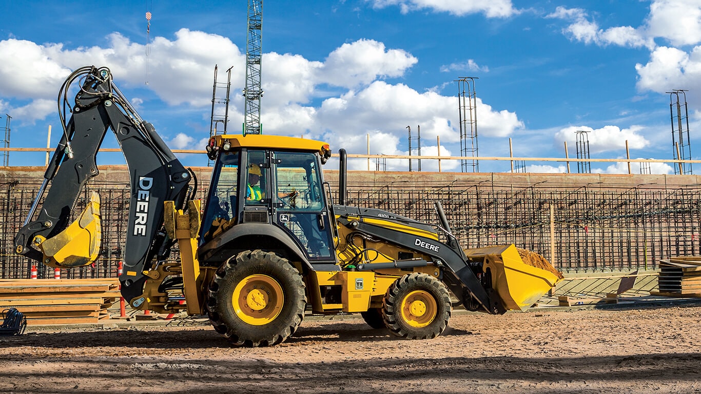 A 410 P-Tier backhoe working on job site.