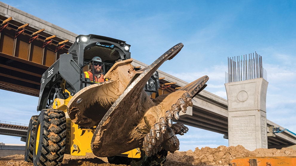 compact loader with auger