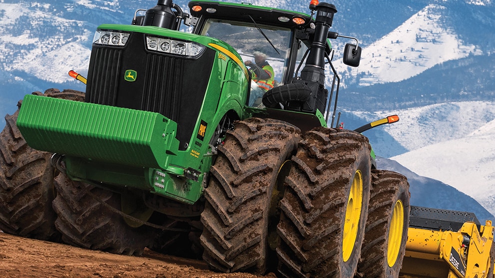 John Deere scraper system in action on a job site