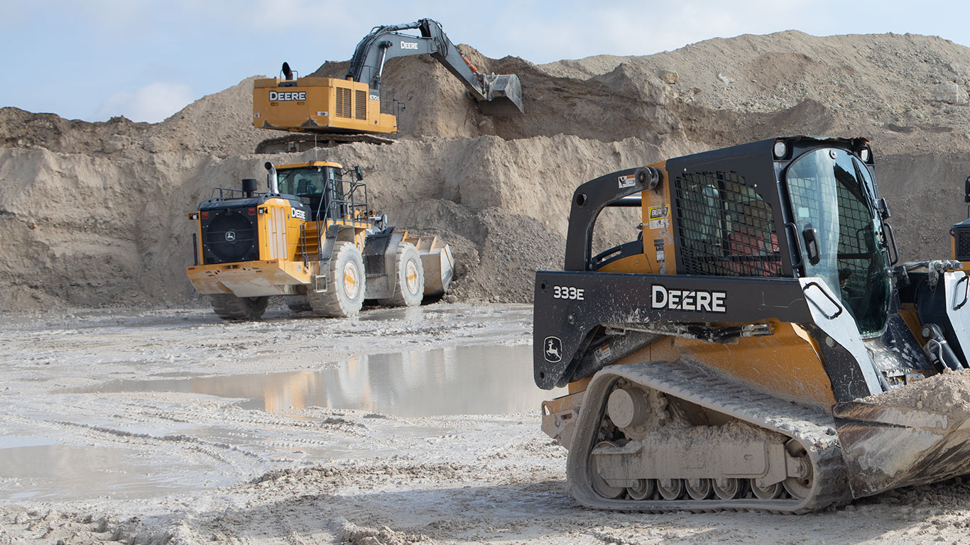 A 870G LC Excavator, a 944K Wheel Loader, and a 333E CTL work in a quarry in Florida