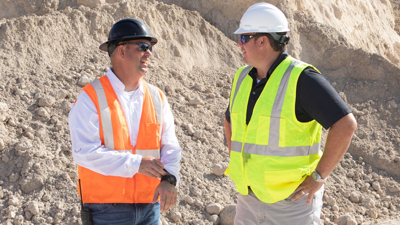 Dobbs Equipment salesman Richard Taylor spends hours on-site with Director of Sales Will Moore (left) and other Bedrock Resources personnel to better learn their complex business and help ma
