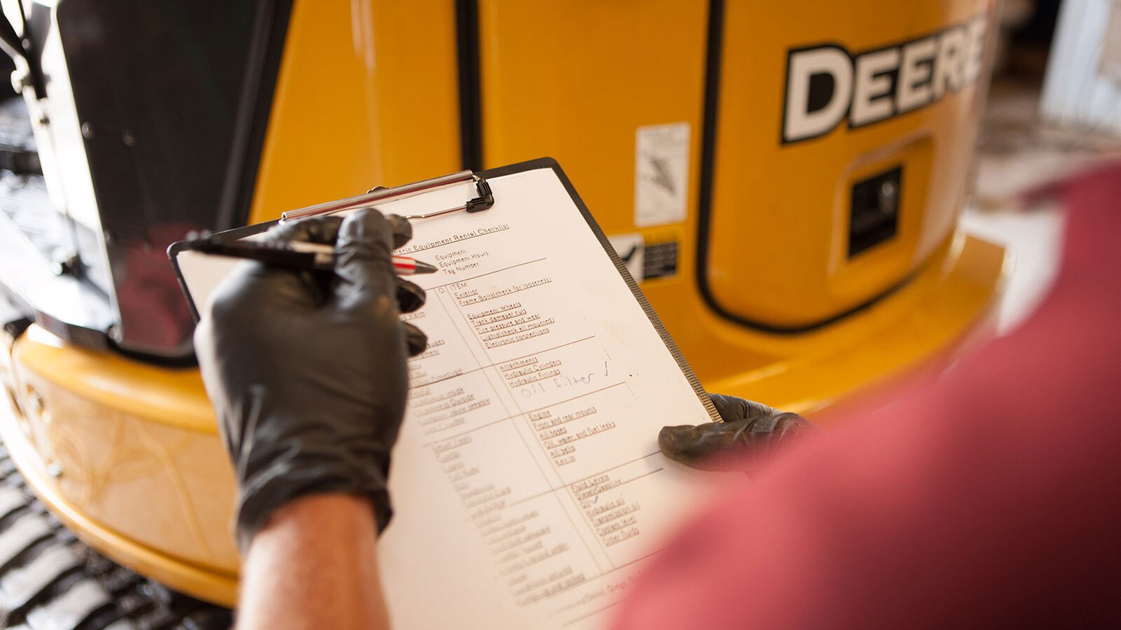 A technician reviews a maintenance checklist
