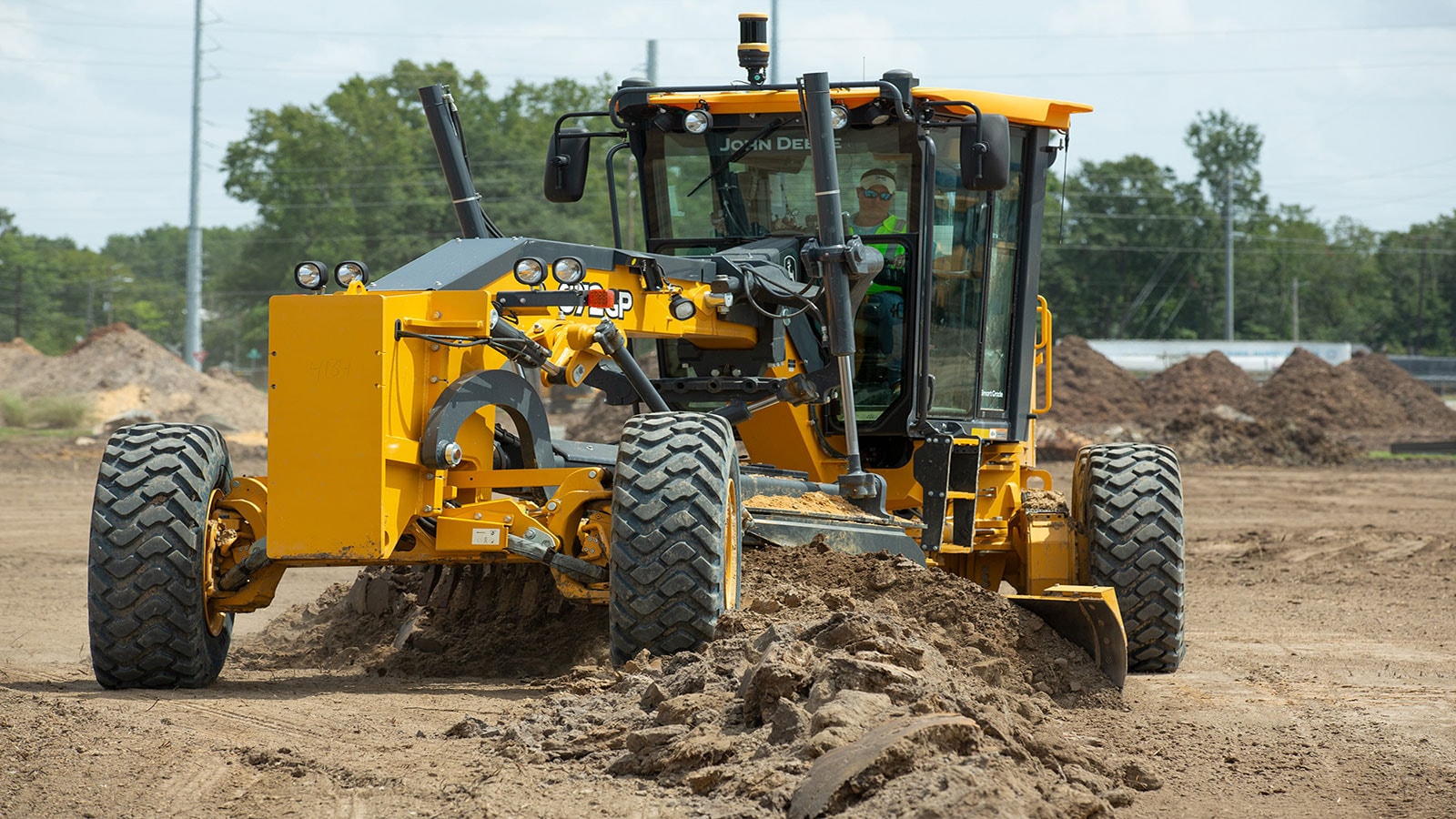 Griffin Contracting operates a motor grader on a job site.