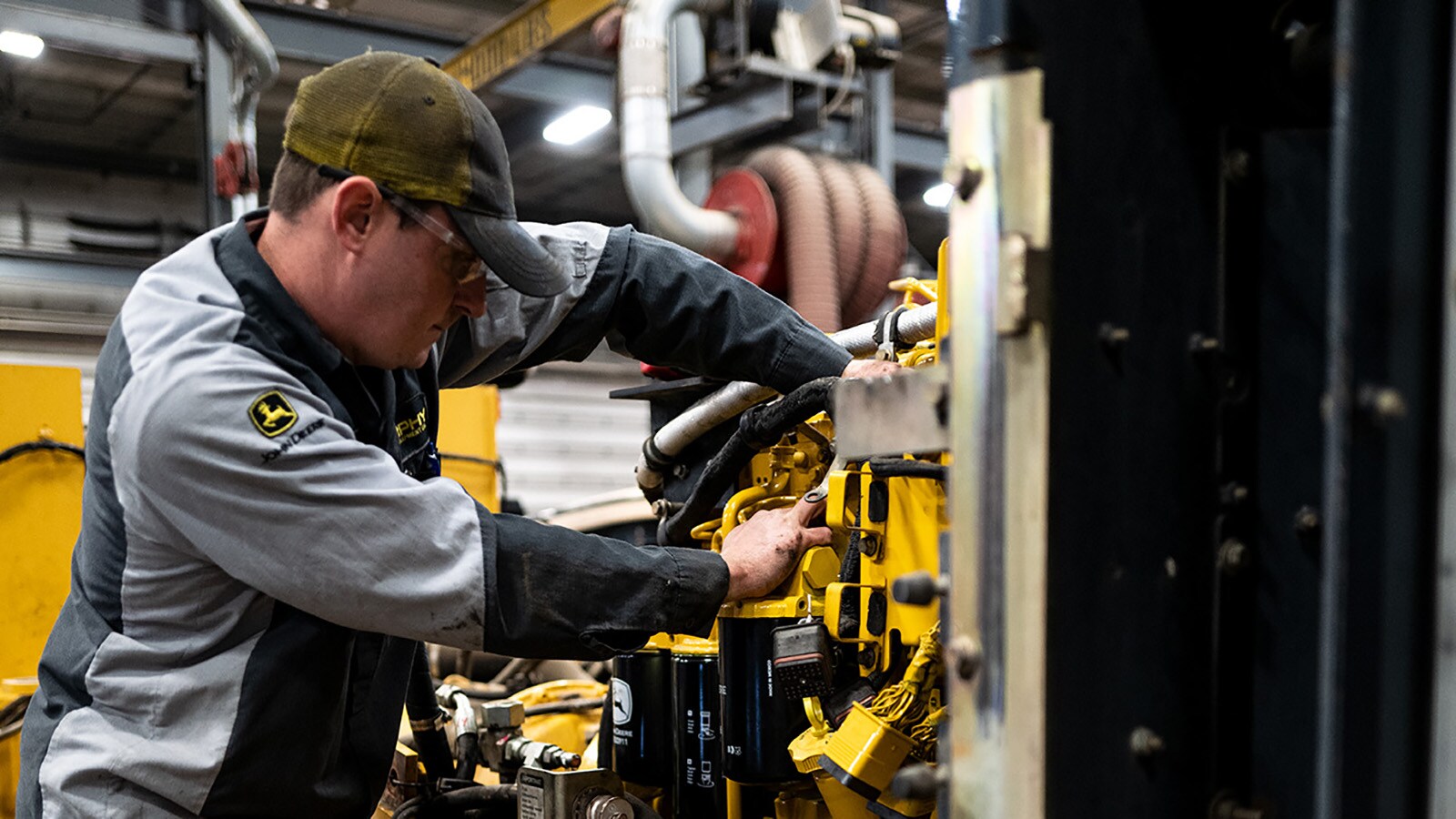 A technician works on a 724K wheel loader rebuilt project