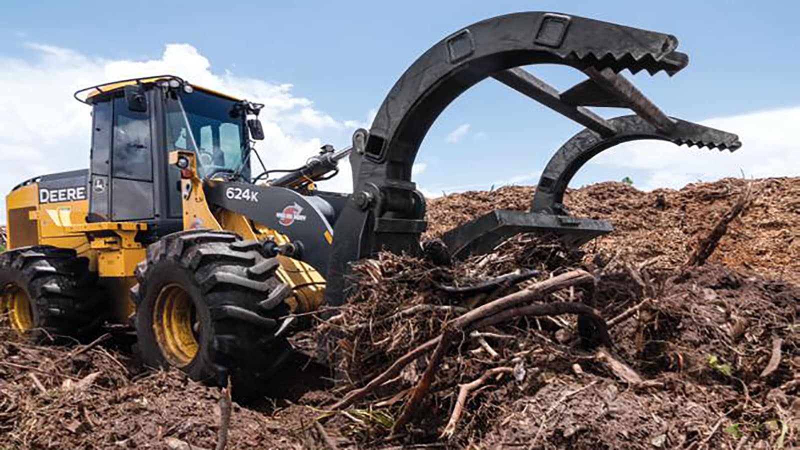 A 624 works on a mass of debris caused my Hurricane Michael