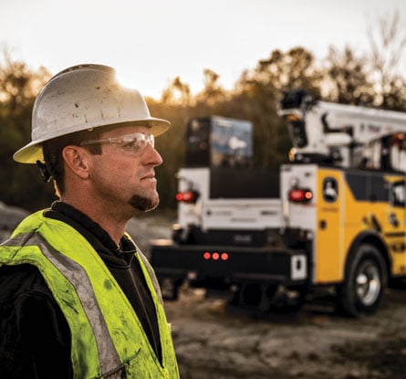 A John&nbsp;Deere field service technician looking in the distance.