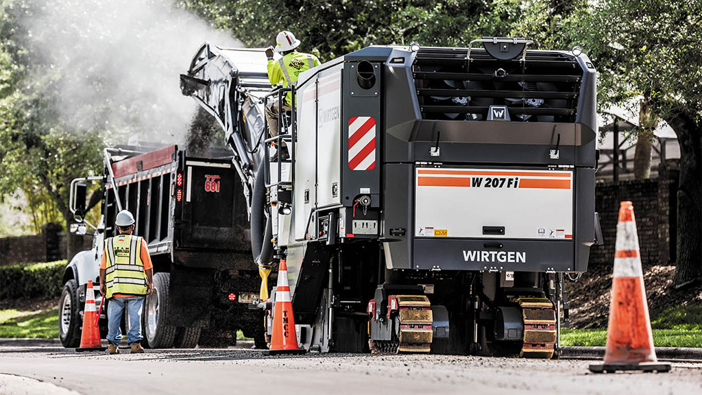 A Wirtgen large milling machine works on building a road.
