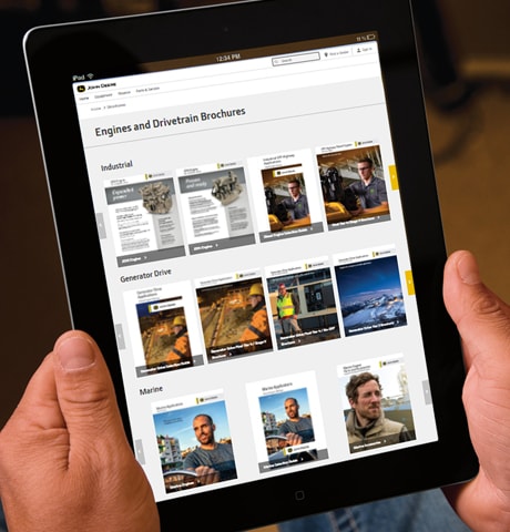 Page du site Web de John Deere sur les moteurs et transmissions affichée sur une tablette iPad
