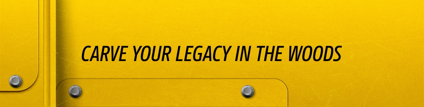 Yellow metal panel with bolts and black text reading ‘Carve your legacy in the woods’