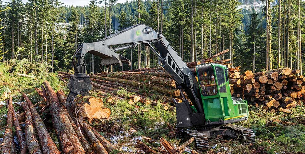 John Deere 3756G LC Loader stacking logs at a landing site