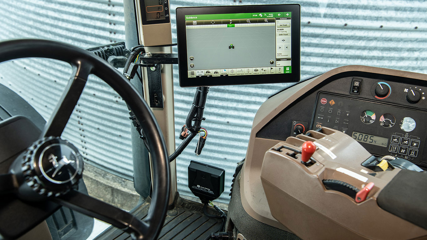 A 12.8-inch digital display in cab of tractor.