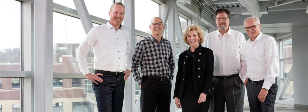 Five winners of 2019 fellows awards stand in a skybridge.