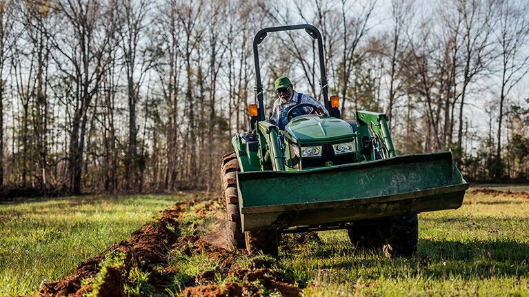 farmer tilling on his tractor