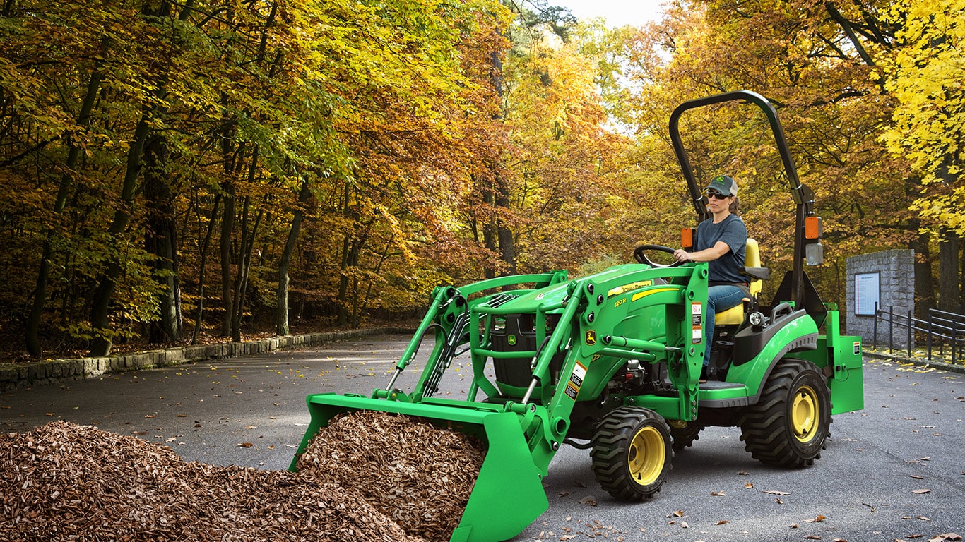 Woman operating a loader