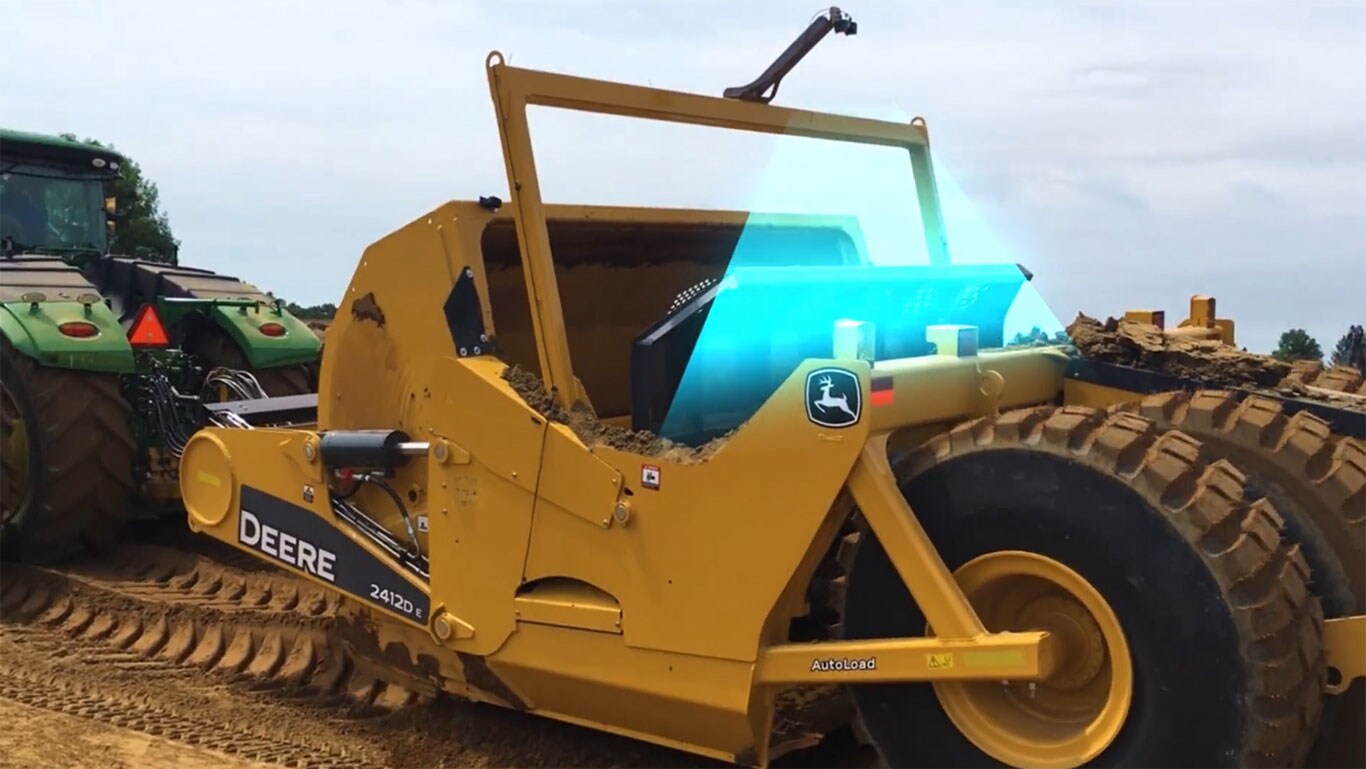 Image of the new scraper earth moving productivity system in action.