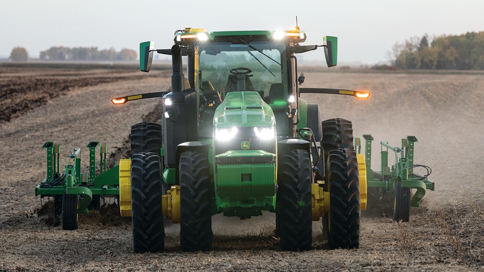 Autonomous tractor in the field - head on view