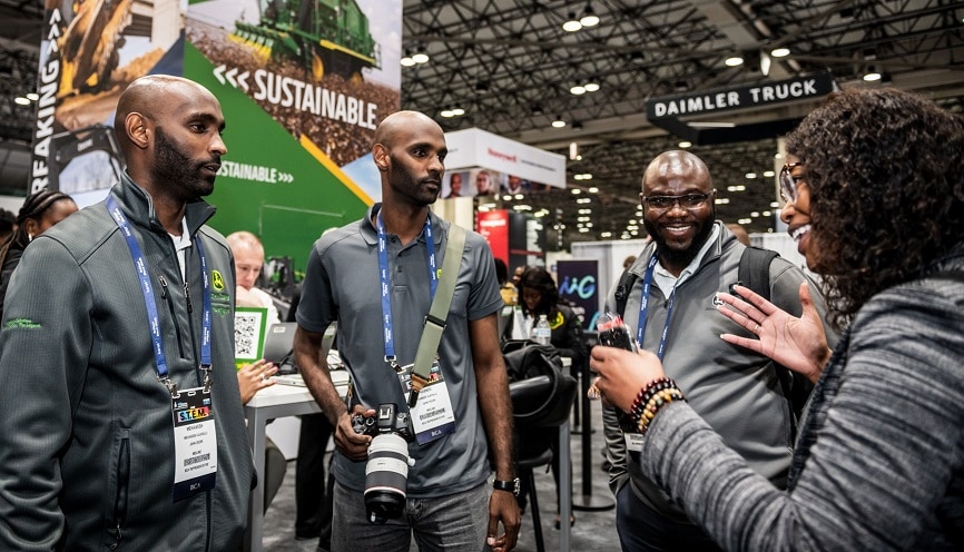 Mehawesh Alkhalil, Kabbod Alkhalil, Setordji Abotsi and Ceená Beall at the National Society of Black Engineers John Deere booth.
