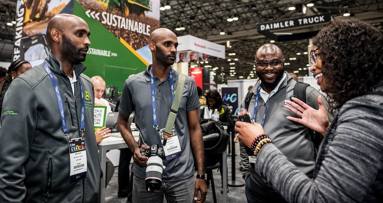 Mehawesh Alkhalil and Kabbod Alkhalil join Setordji Abotsi and Ceen<span>á</span> Beall at the National Society of Black Engineers John Deere booth.