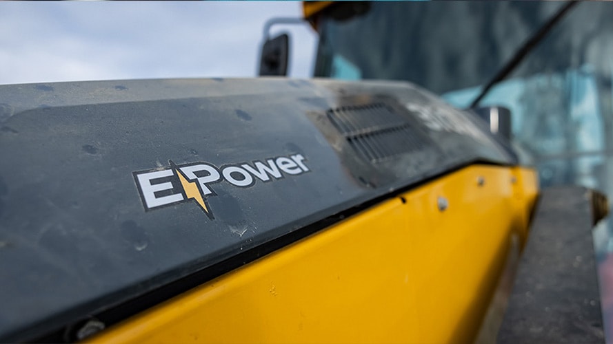 Closeup of an "E-Power" decal on construction equipment