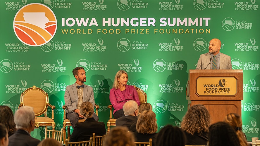 An audience watches a speaker at the Iowa Hunger Summit