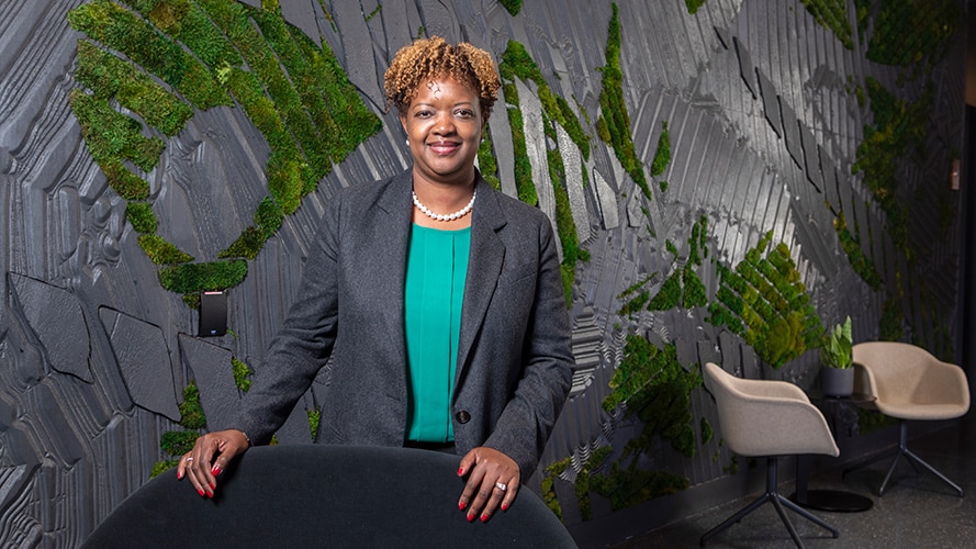 A photo of Johane Domersant sitting in John Deere's Chicago office.