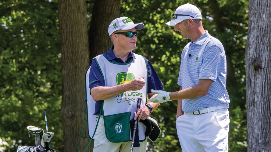 John May and Joel Oltman chat between rounds at the John Deere Classic Pro-Am