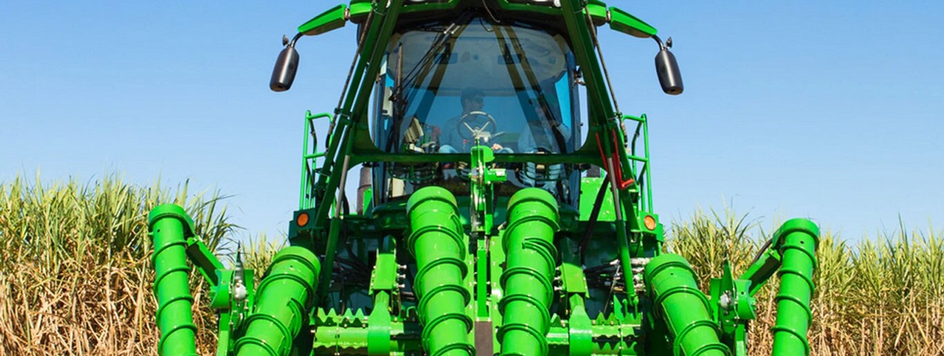 A front view of a CH950 harvesting sugar cane