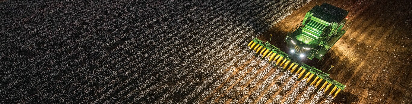 a combine harvesting a cotton field