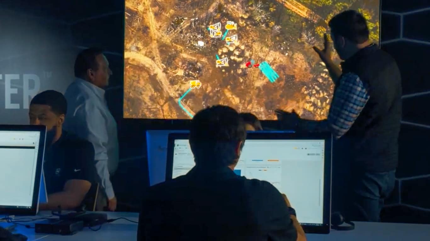 John Deere dealers looking at computer screen with data