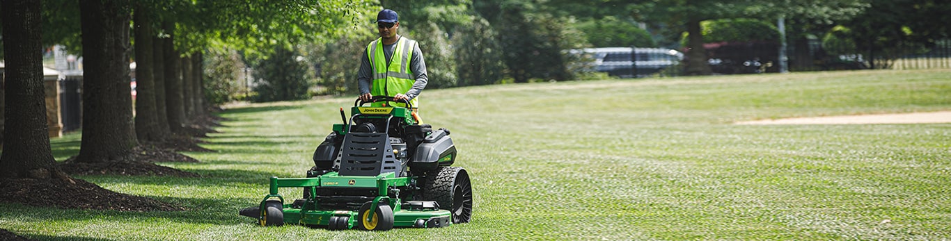 A man mowing with a QuikTrak mower