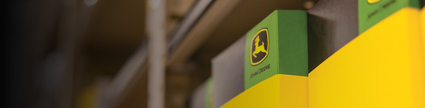 John Deere parts boxes on a shelf