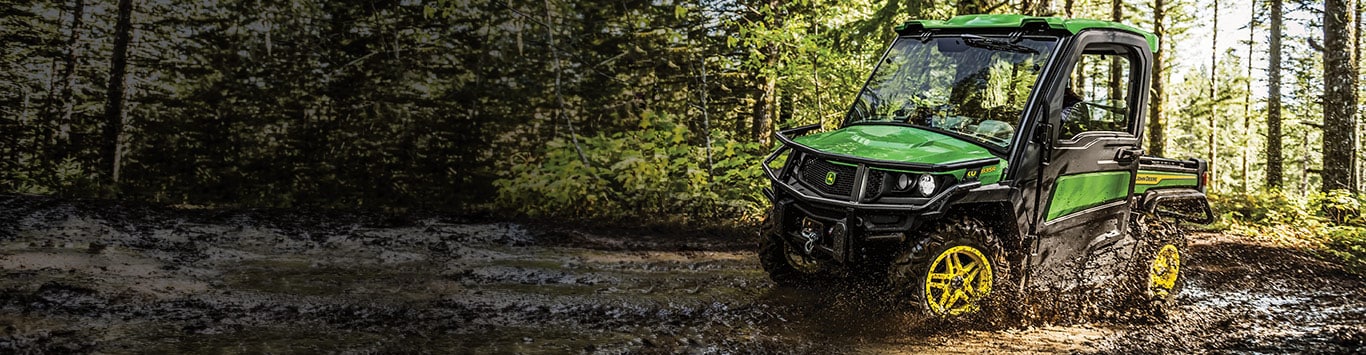 Gator XUV driving through mud