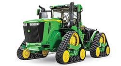 Green John Deere 9 Series row crop tractor with tracks and front dual wheels displayed on a white background.