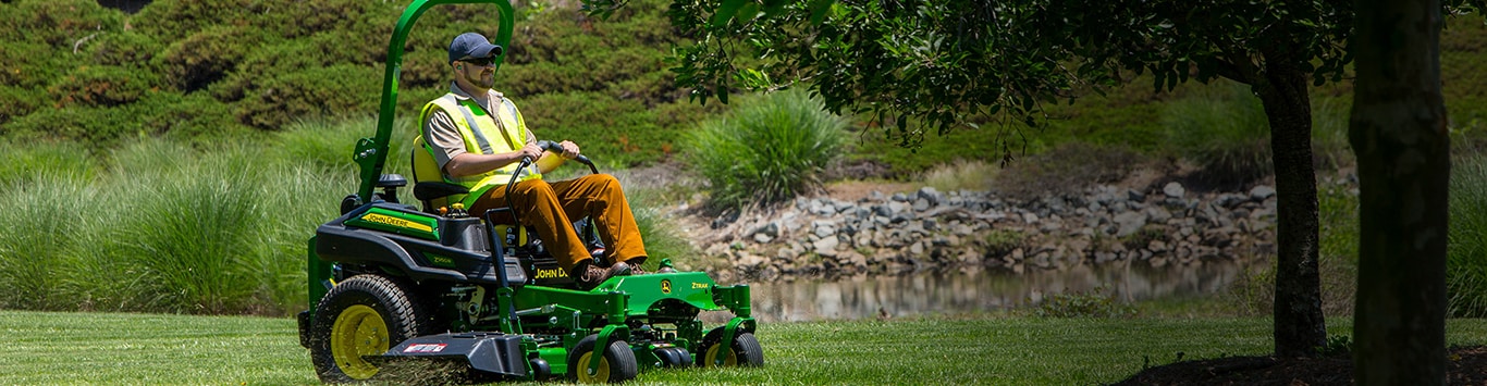 Man driving a z950r along a pond