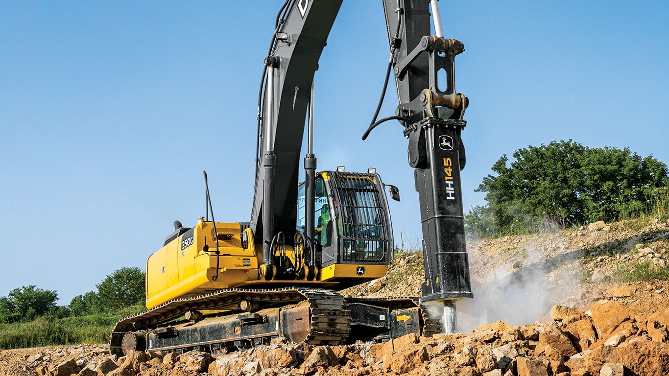 250G Excavator with hammer attachment on worksite.
