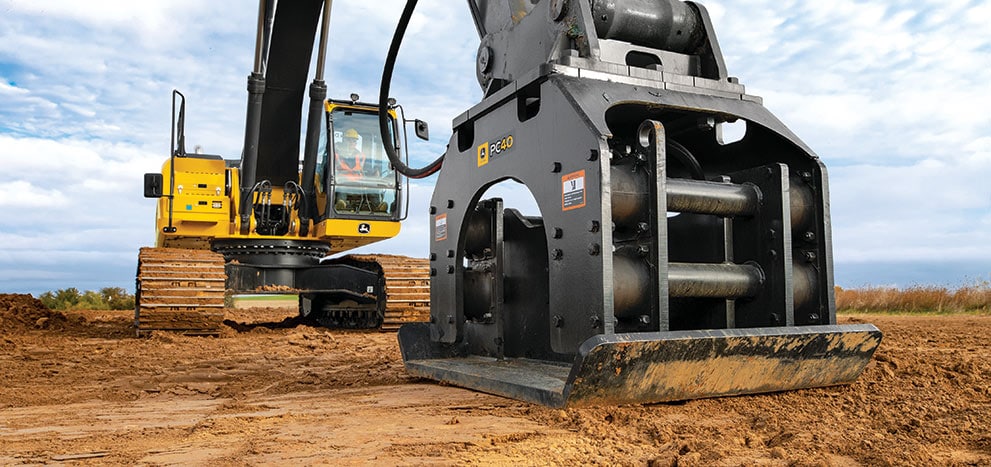 Excavator with plate compactor attachment