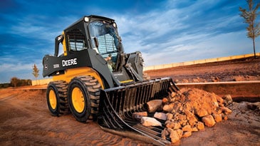 Rock bucket on 320E Skid Steer