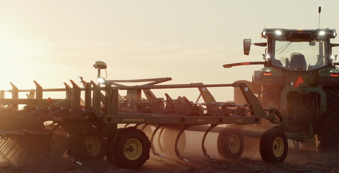 Photo of tractor tilling that links to John Deere Autonomous 8R Tractor video.