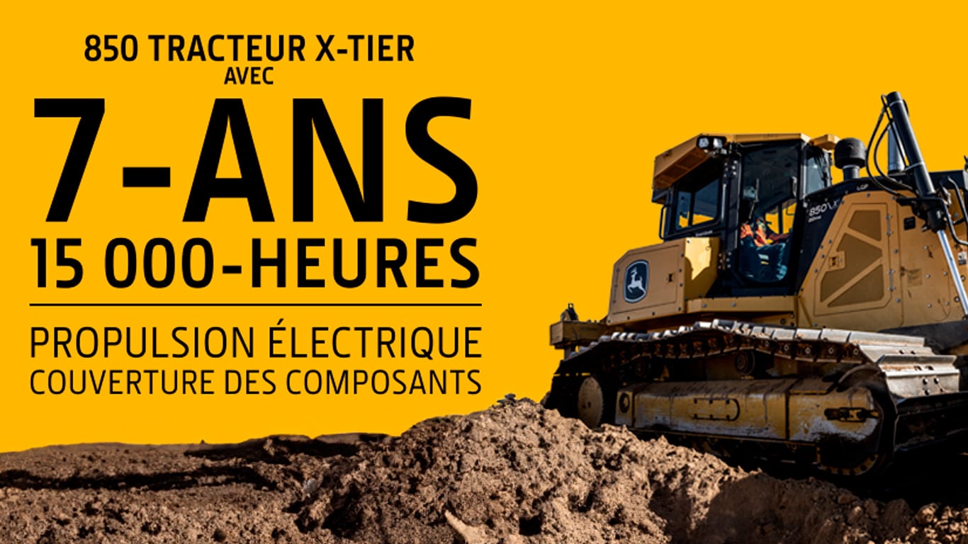 Bouteur sur un chantier de construction avec un texte qui fait la promotion du programme de protection de 7 ans/15 000 heures des composants de l'entraînement électrique