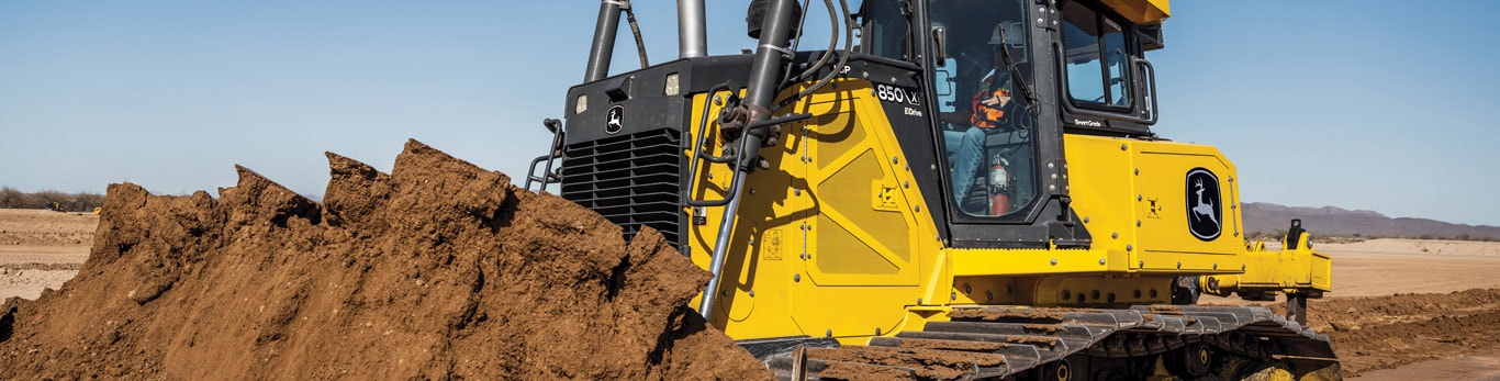 850 X-Tier Dozer pushes a load of dirt