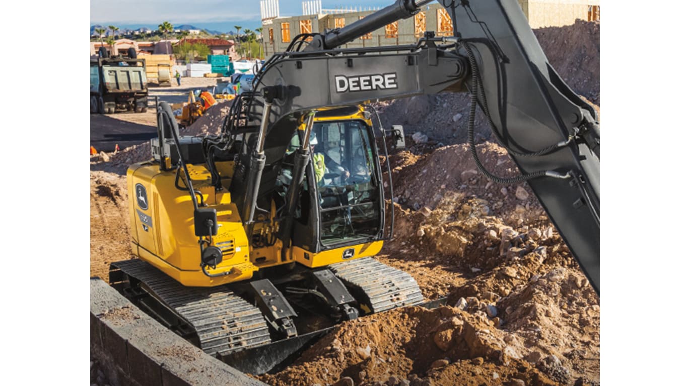 A close-up of the 135P-Tier Excavator cab at a worksite.