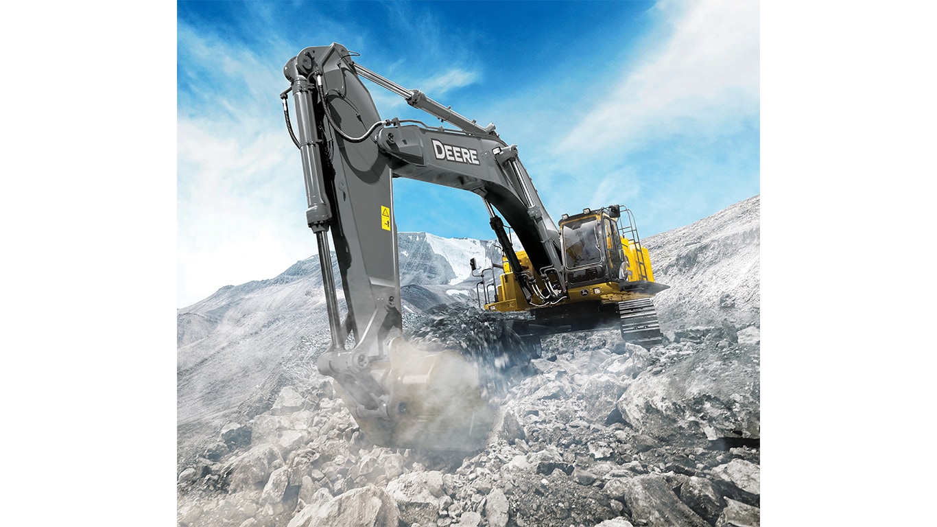 A 670P-Tier Excavator scooping up rock in a quarry worksite.