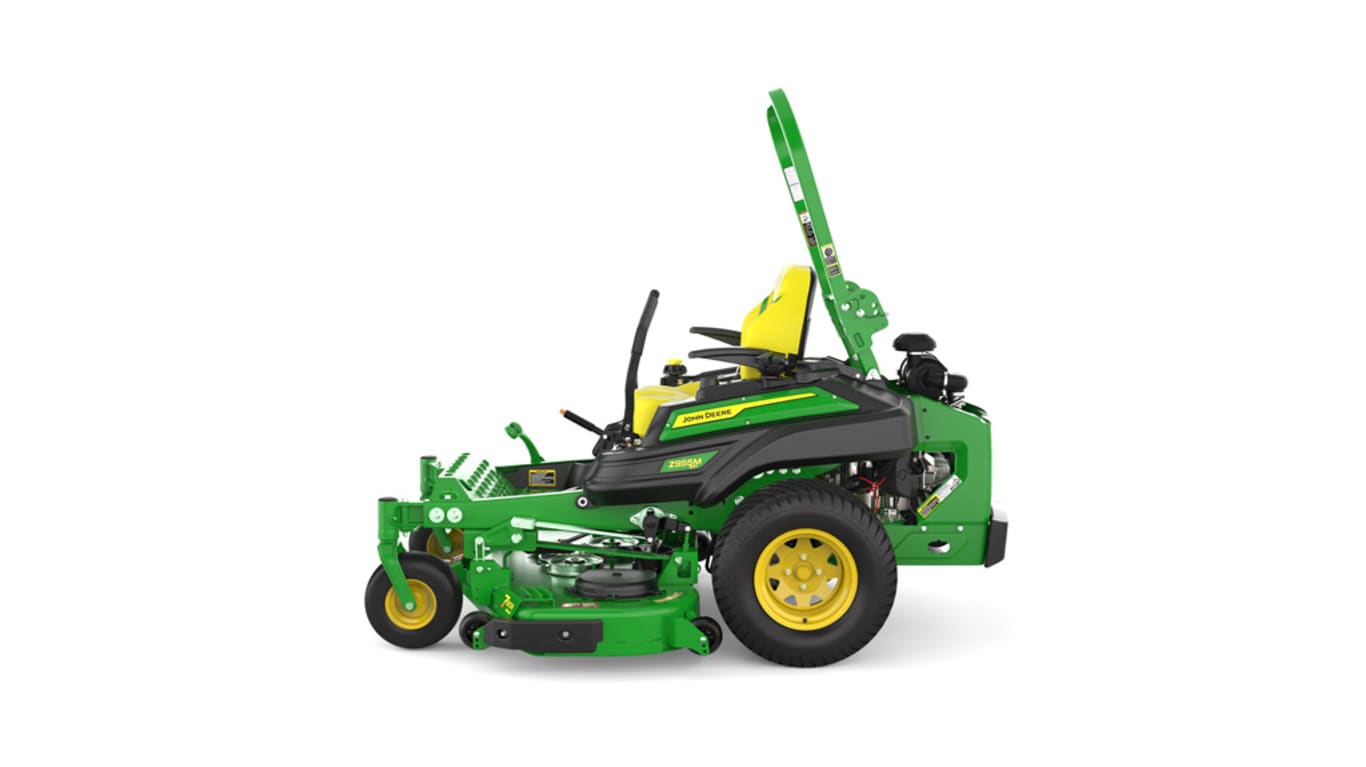 Left-side view of a green mower with yellow accents